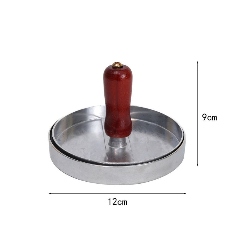 Wooden-handle burger press showing its 12 centimetre diameter and 9 centimetre height