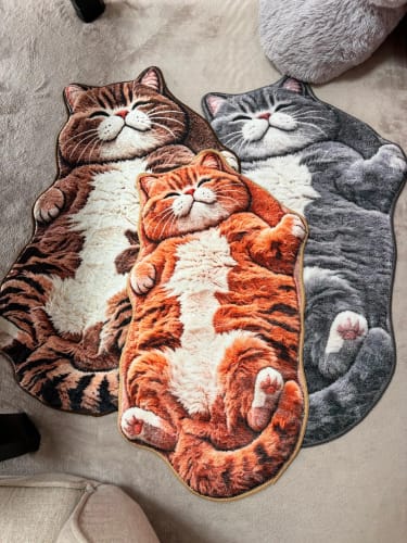 Three cat mat designs displayed together